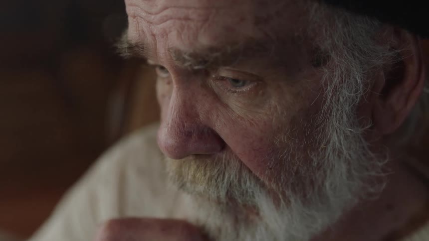 Elderly Man Living In Cabin
