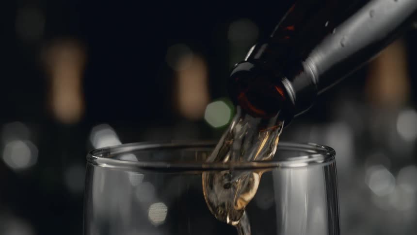 Beer pouring into a glass in slow motion