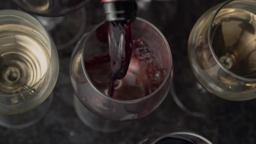 Wine is poured into a glass