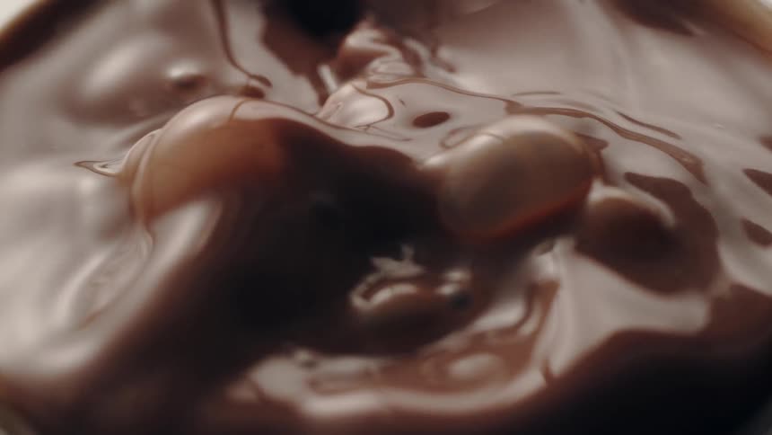 Chocolate is poured into a container