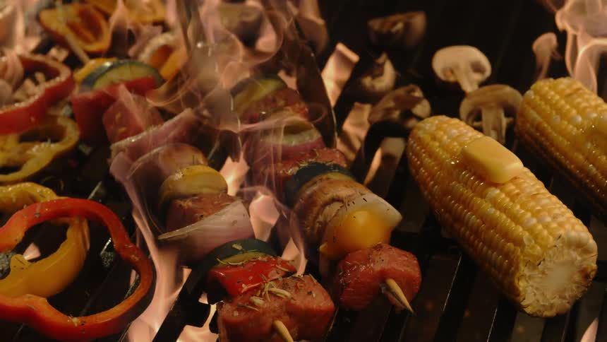 Beef and vegetable skewers on firey grill