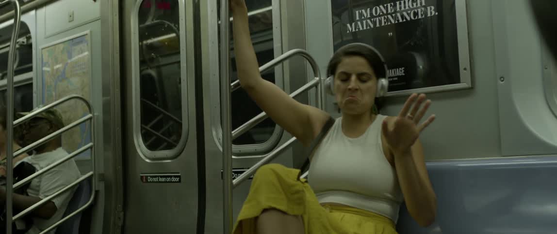Woman is dancing in subway train