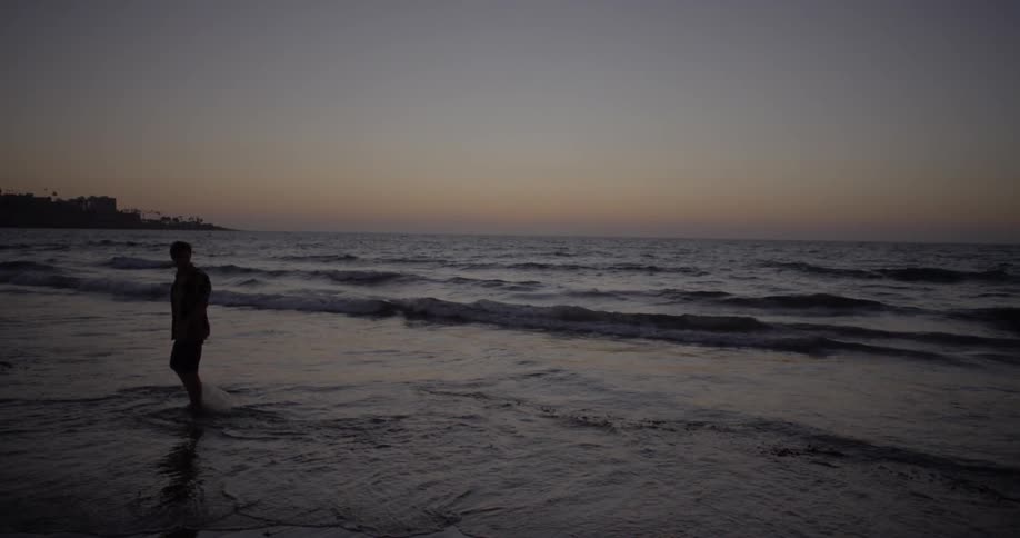 Man At The Beach During Sunset