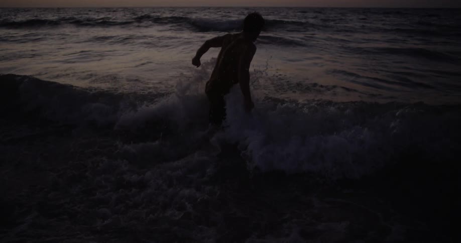 Man At The Beach During Sunset