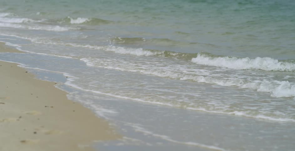 Waves crashing onto a beach