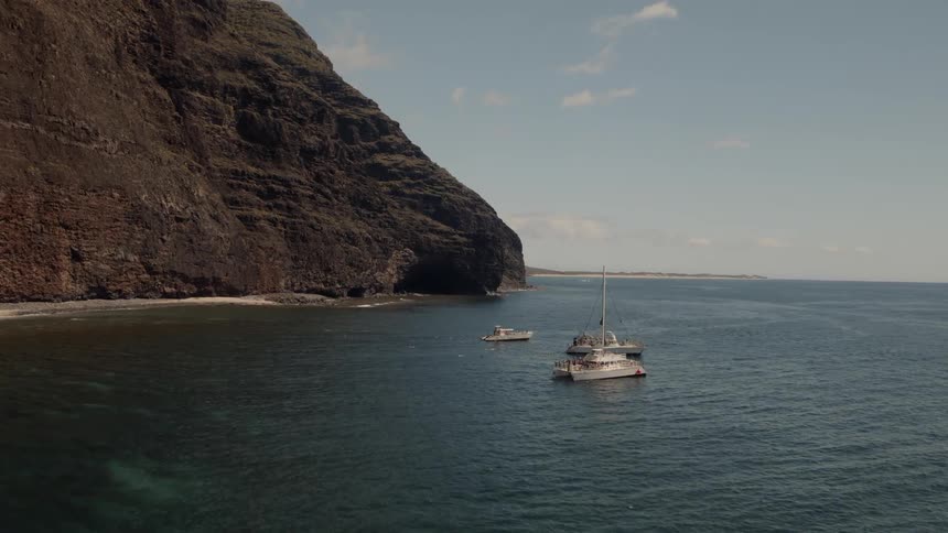 Three boats are still near the shore