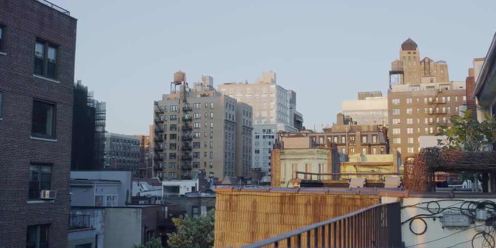 The tall buildings cover the city on a sunny day