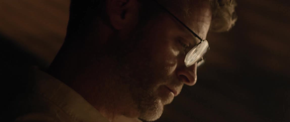 Man is in deep concentration while working at a desk
