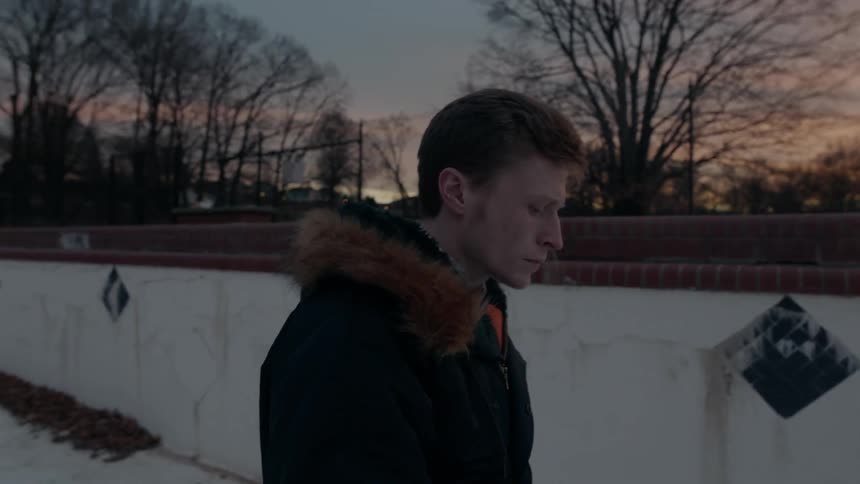 A man smokes outside in the cold