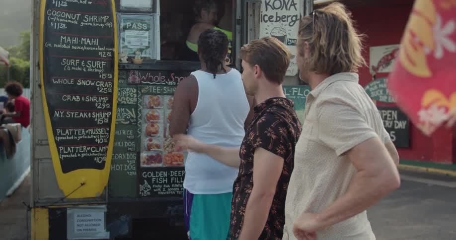 People wait in line at a food vendor