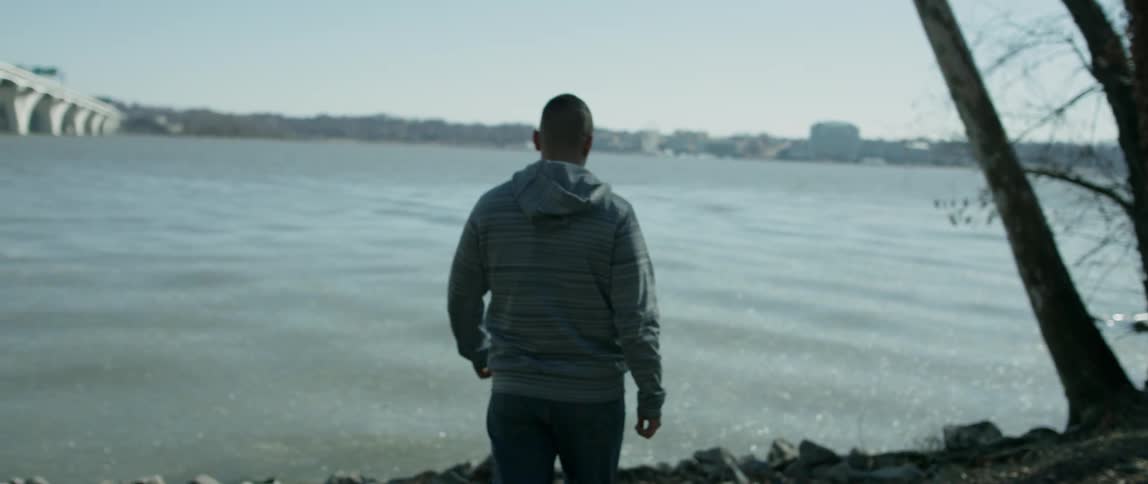Man Walking Alone In City