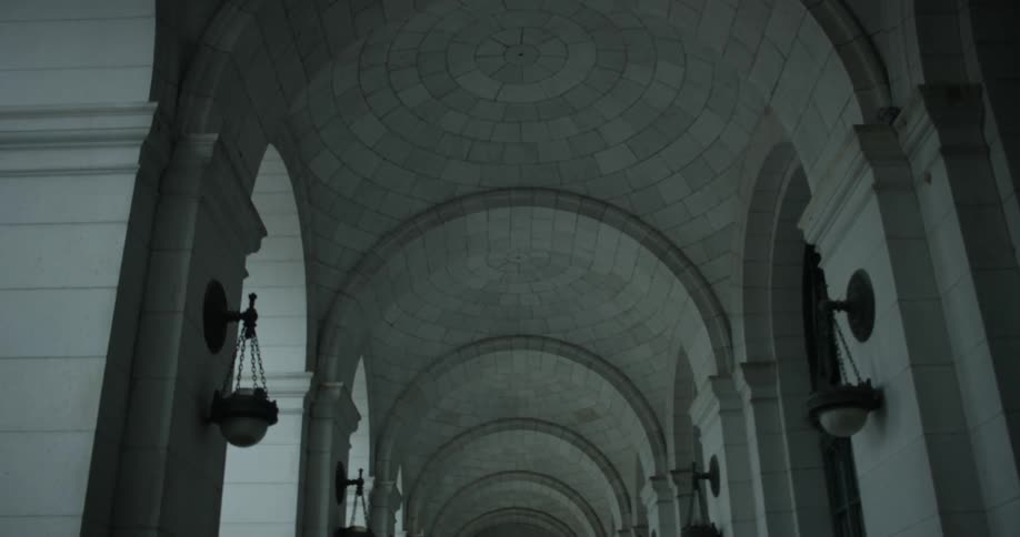 Light fixtures hang in a stone building