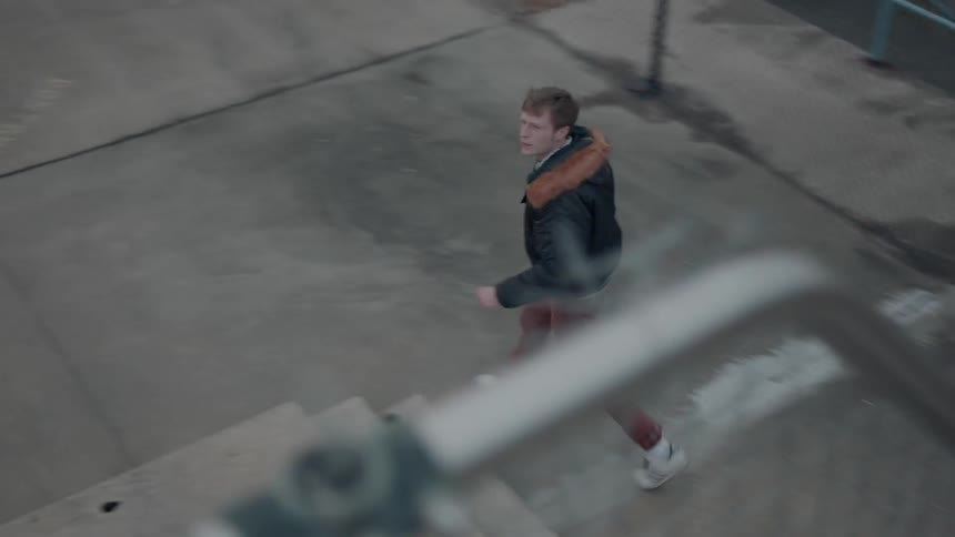 A man walks off by the pool