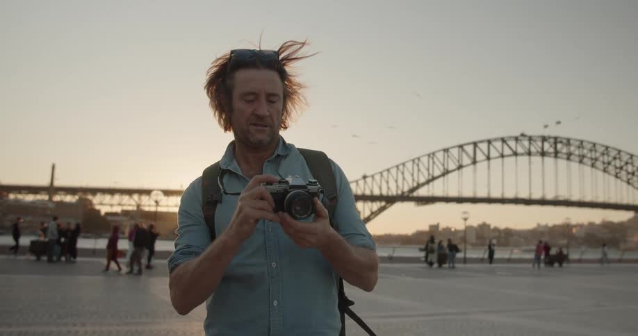 A man takes photographs outside