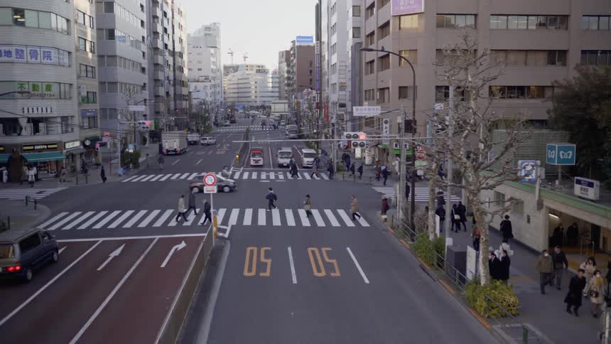 Pedestrians cross a city street
