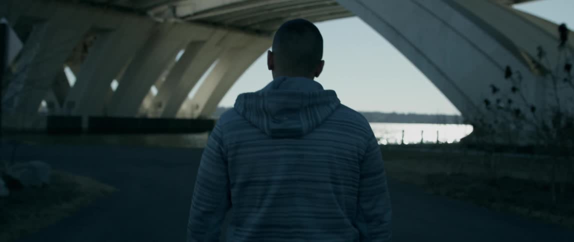 Man Walking Alone In City