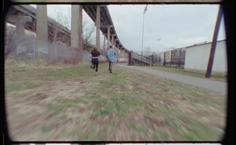 People run together near the overpass