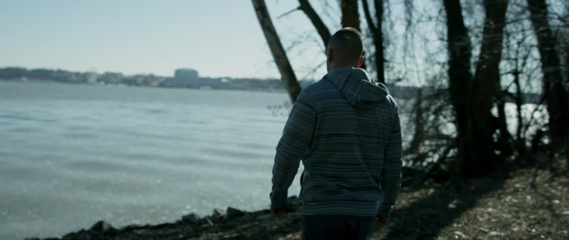 Man Walking Alone In City
