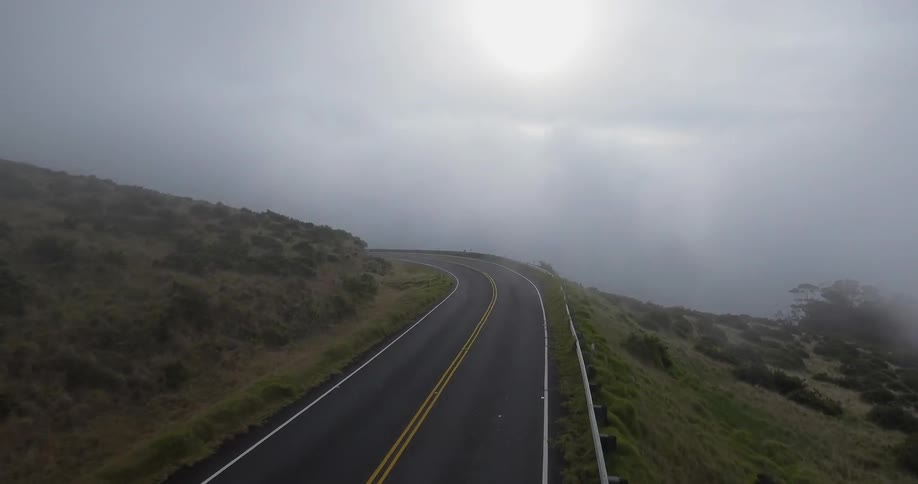 A highway near an ocean on foggy day