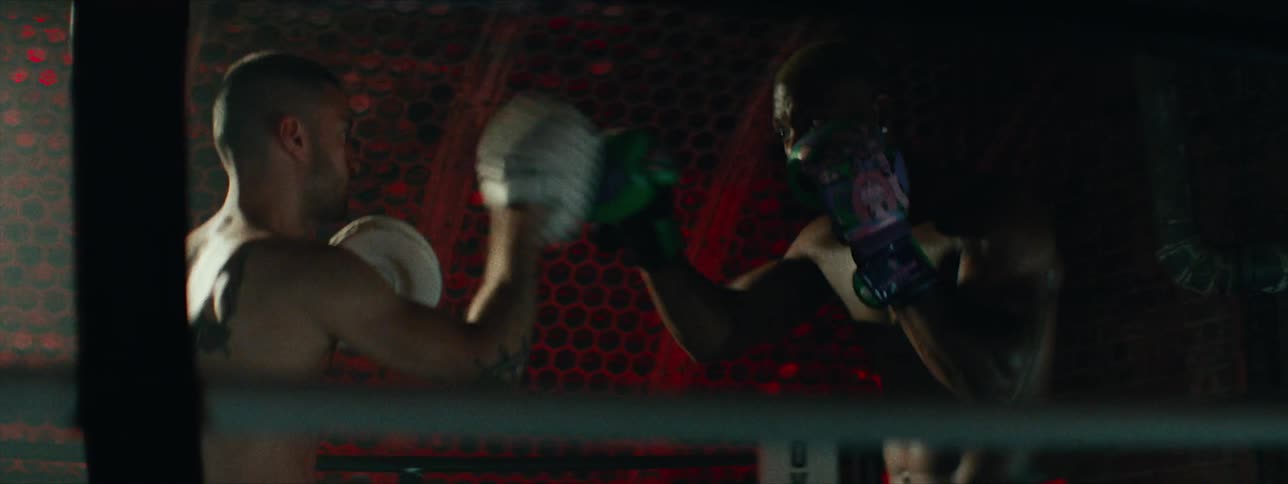 Two men box in a boxing ring