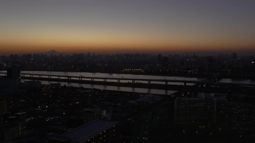 The sun is nearly set over the city