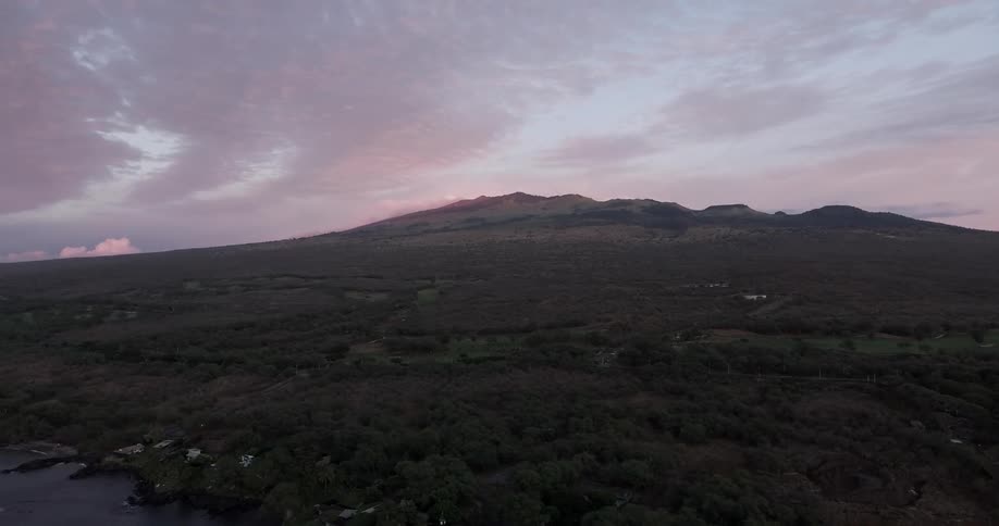 A mountain on a cloudy evening