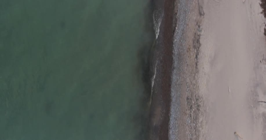 Waves flow ashore on the beach