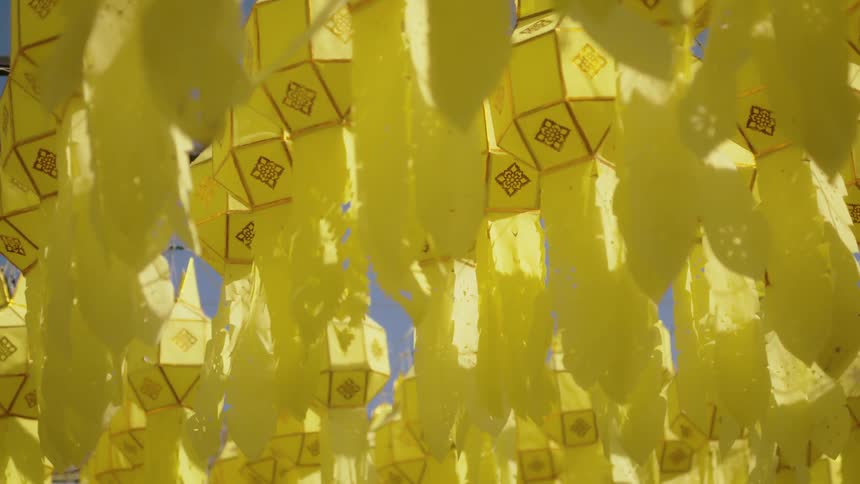 Hanging lanterns sway in the breeze