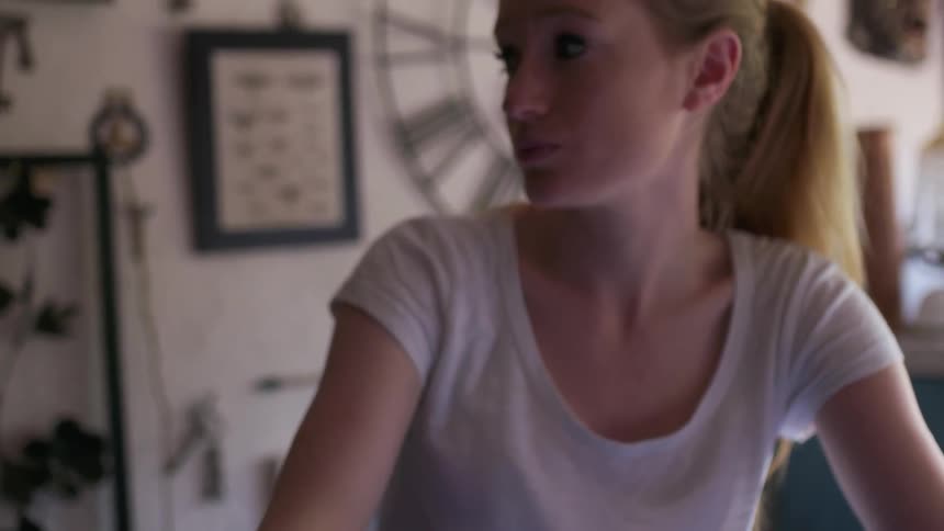 A woman sips from a coffee cup
