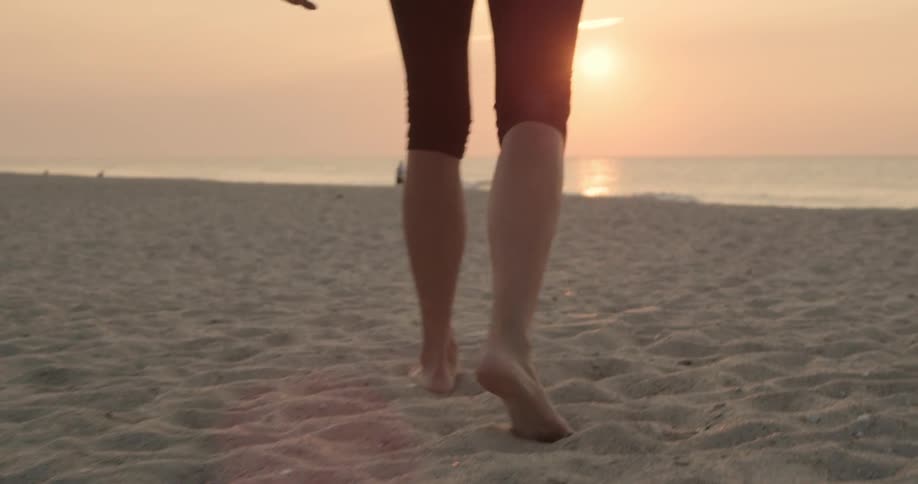 A person walking on the beach