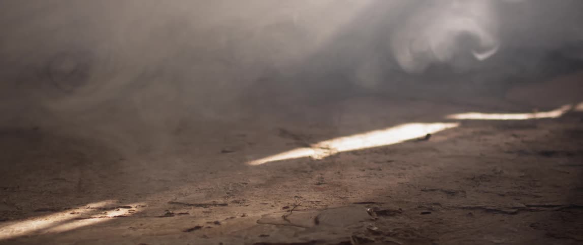 The ground is covered in thick smoke