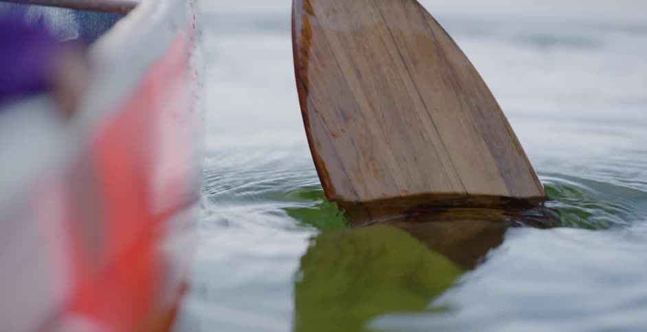A man paddles a boat