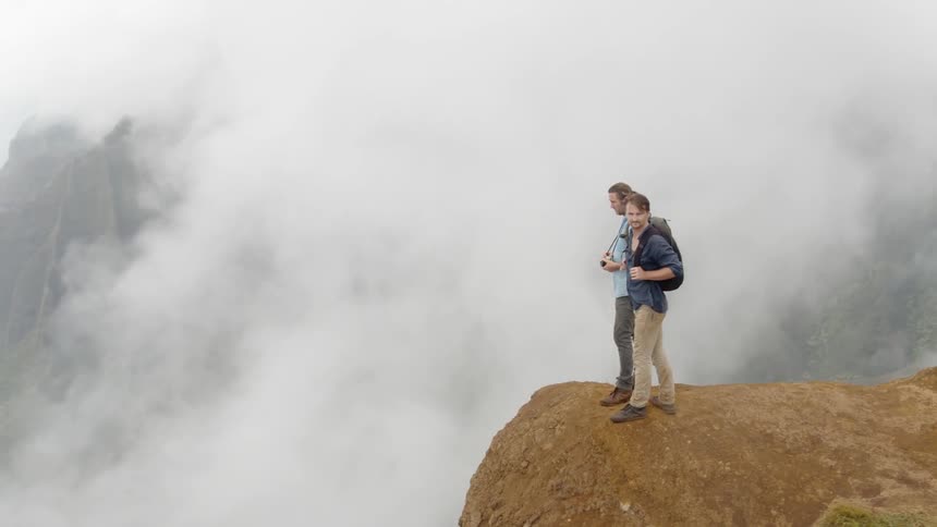 Two men on a mountaintop