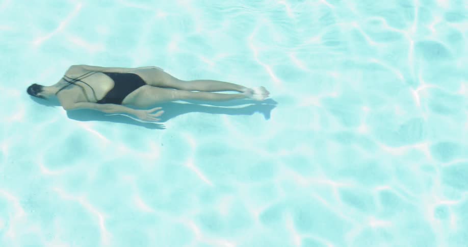 Woman Swimming In Pool