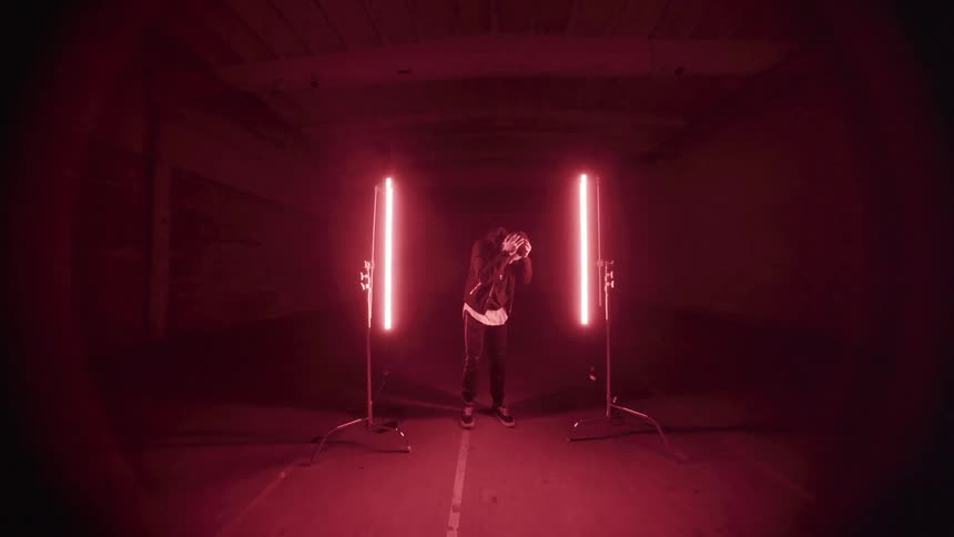 Man dancing in a tunnel