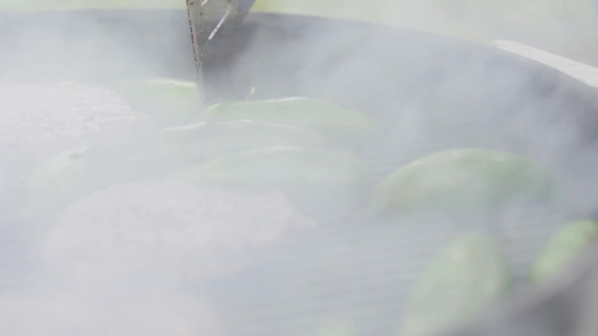 Hamburgers being cooked on a grill