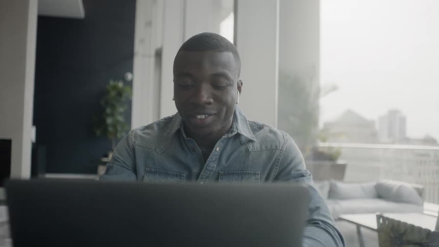 A man works on his laptop