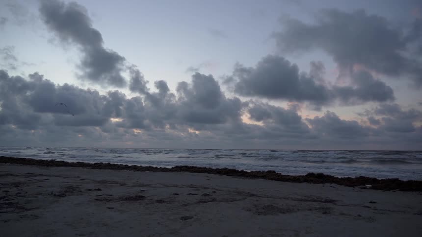 Clouds gather over beach