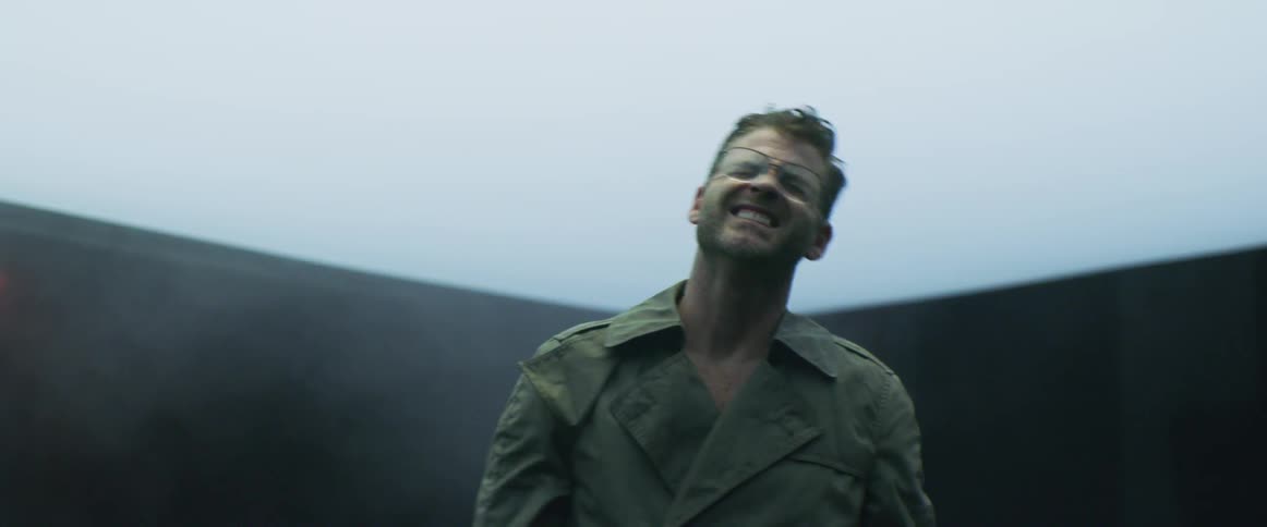 Man shields his eyes from light that gets turned off