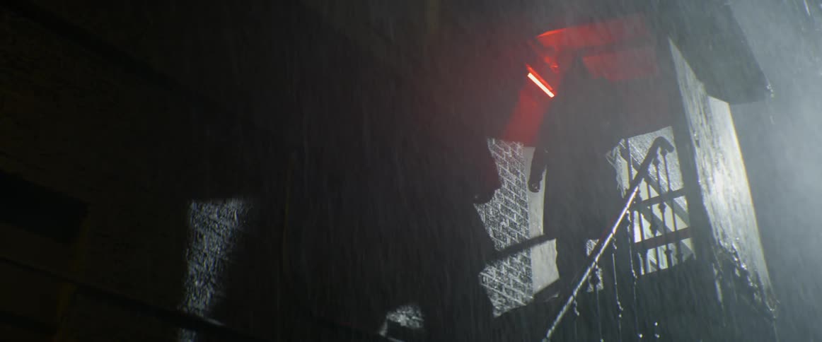 Man stands on the stairs in the rain