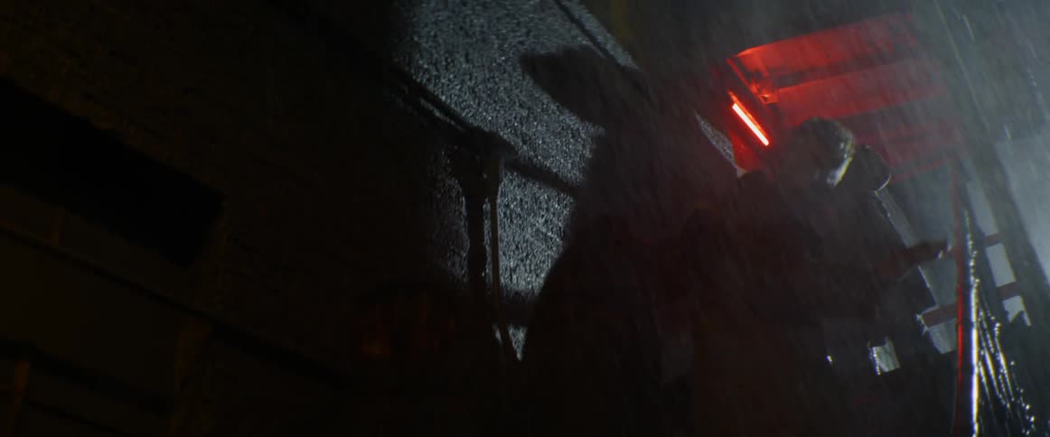 Several people climb the stairs as the rain falls