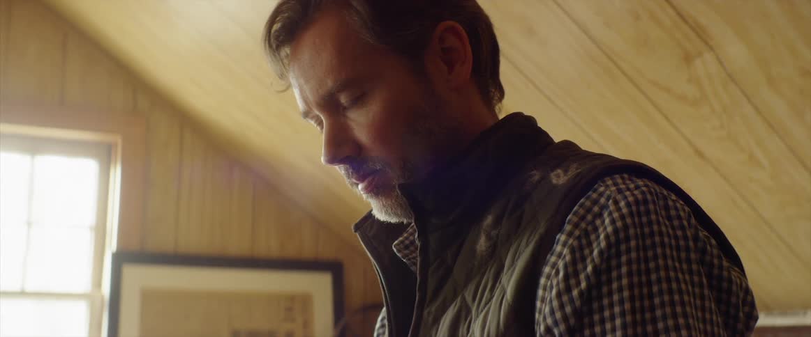 A man stands in an attic