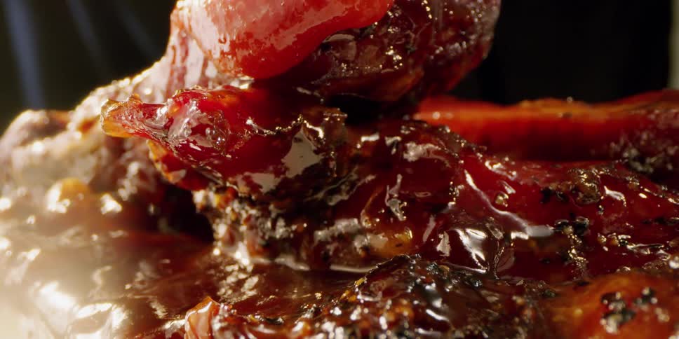 Sauce pours down over the meat
