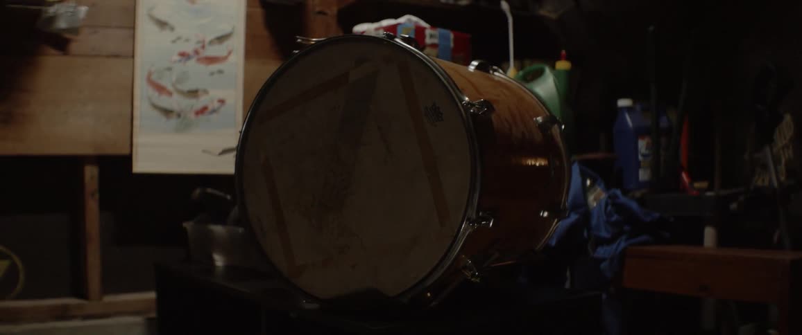 A drum sits on its side on a table