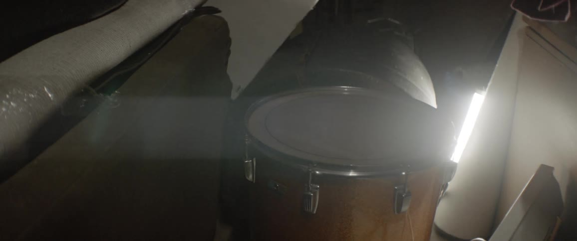 Light shines behind a drum