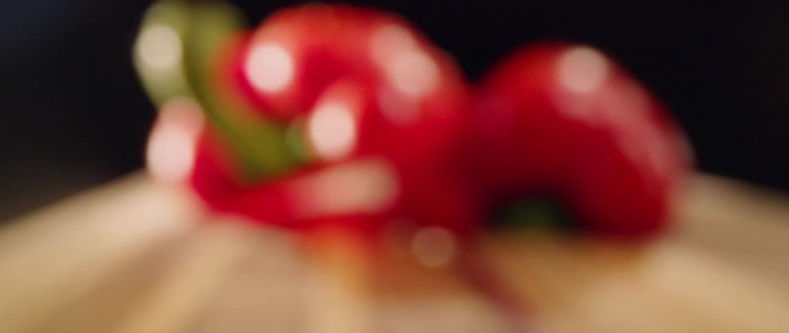 Water droplets shine off of several tomatoes