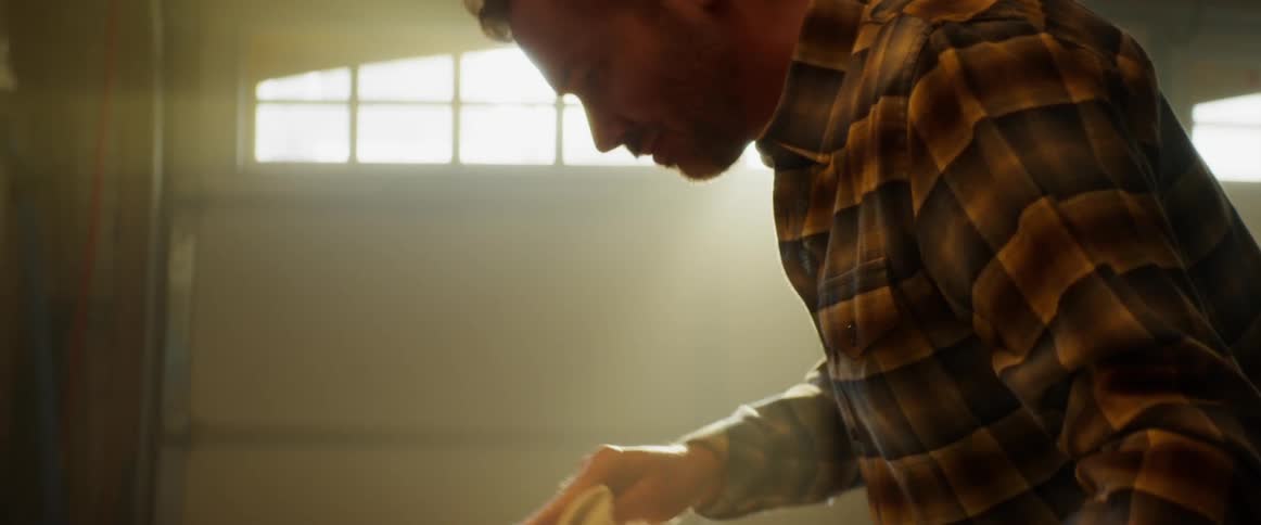 Man Refurbishing Guitar