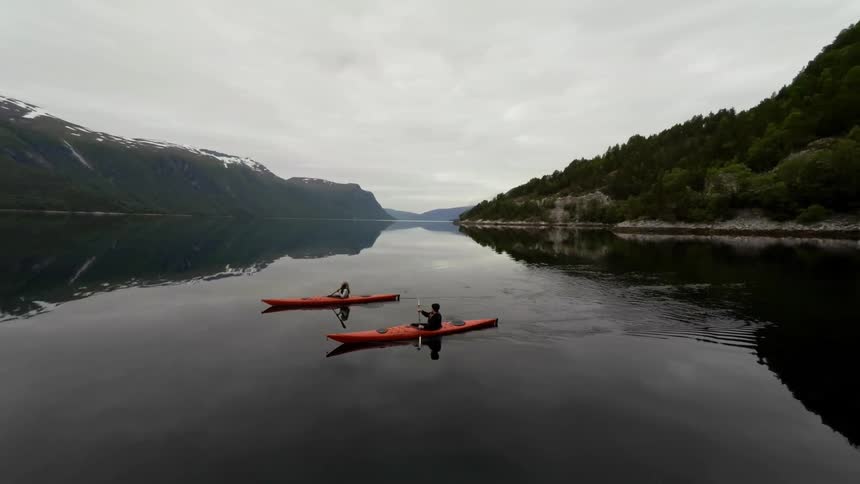 People rowing canoes in a lake