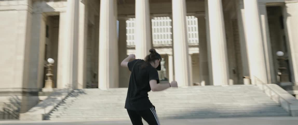 Man Dancing Around The City
