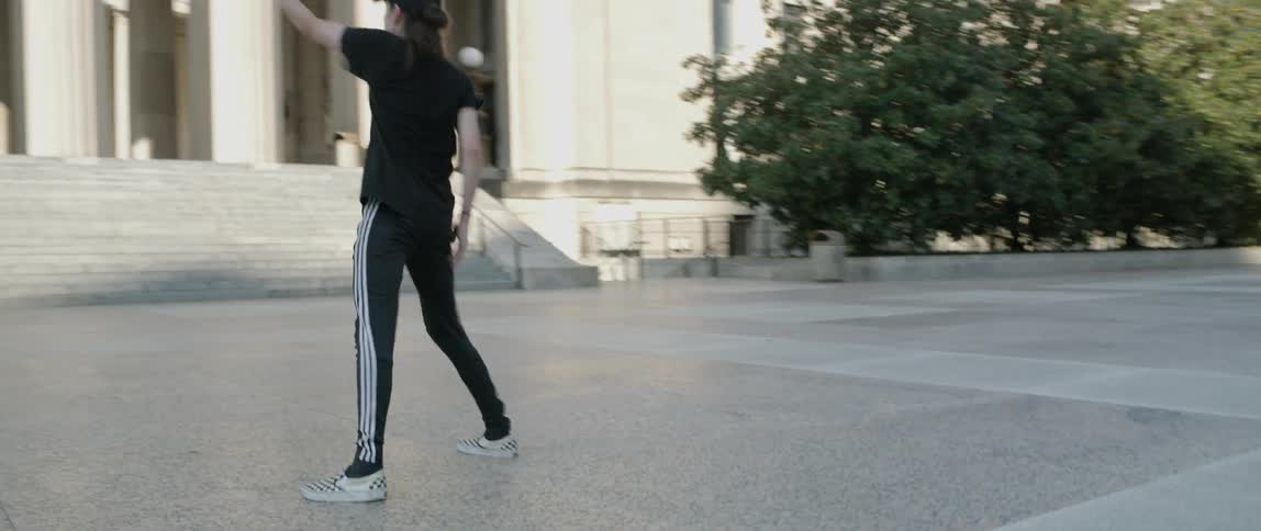Man Dancing Around The City